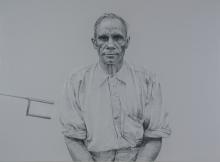 A portrait made in charcoal, crayon and paint of an older man wearing a button-down shirt, posed front-on.