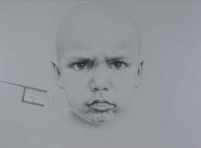 A portrait made in charcoal, crayon and paint of a little boy's face; posed front-on, he frowns at the viewer.