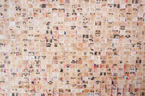 Installation view of a large work composed of hundreds of smaller works on paper