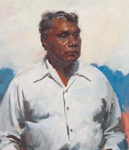 Portrait of an Indigenous man with a cloudy sky behind him