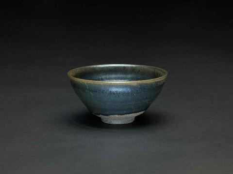 Artwork Tea bowl this artwork made of Stoneware, black/brown clay thrown with lizard skin tenmoku glaze, created in 1987-01-01