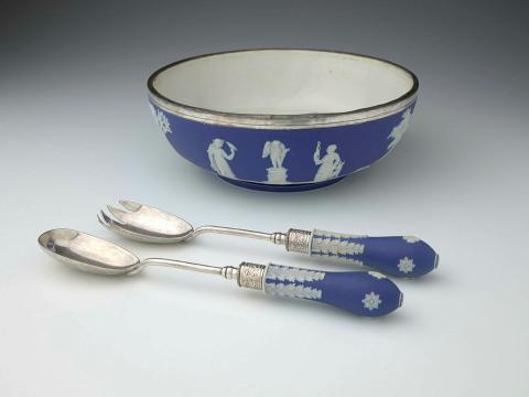Artwork Bowl and servers this artwork made of Stoneware (jasper) dipped blue and sprigged with neo-classic motifs.  Plated silver rim, created in 1850-01-01